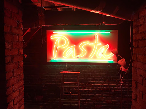 Live Music Field Guide: DIY Music Spaces of Allston. Red neon sign that reads "Pasta" belonging to Pasta Planet