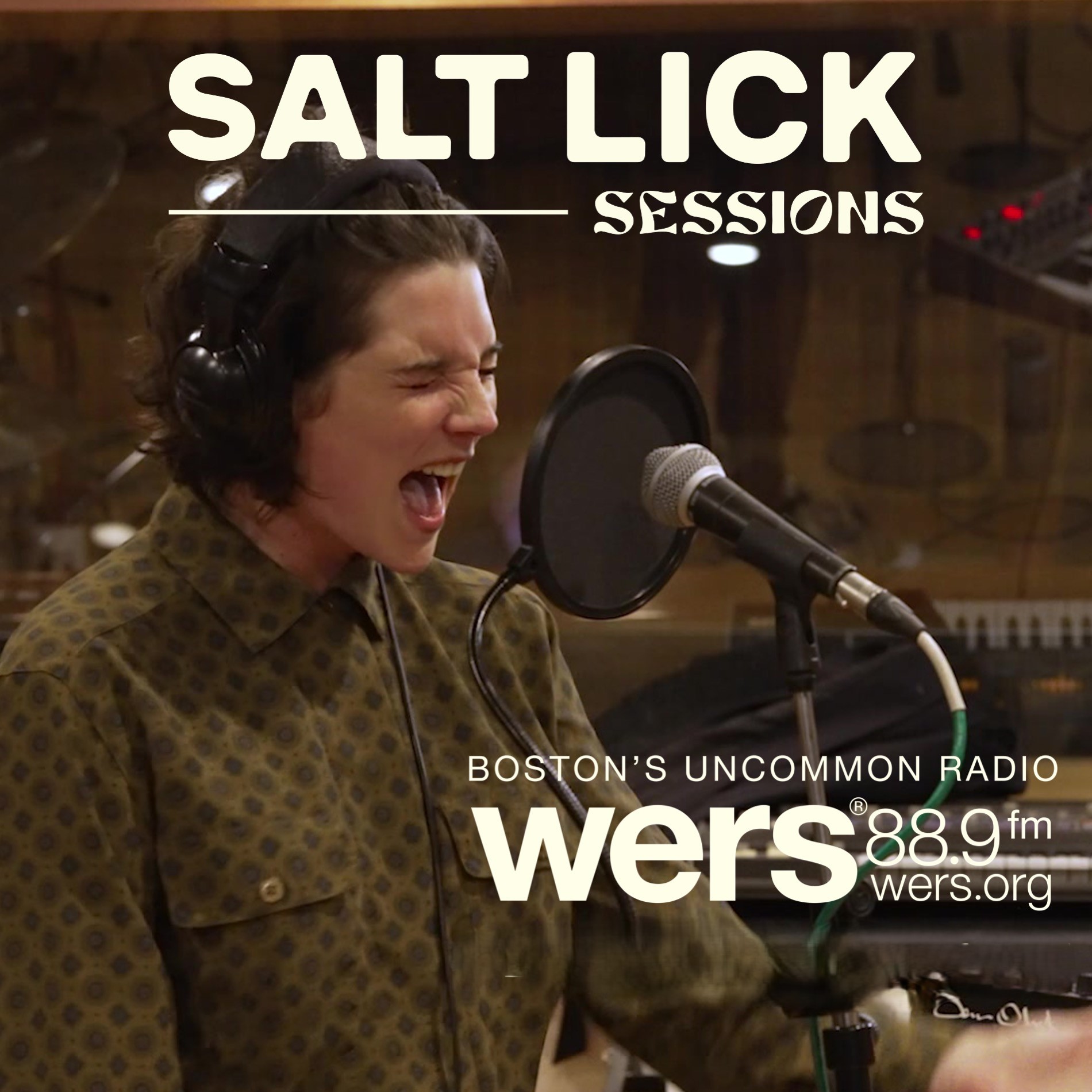 Sammy Rae with headphones singing with mouth wide open and eyes closed in a studio. WERS and Salt Lick Sessions logos laid over the photo