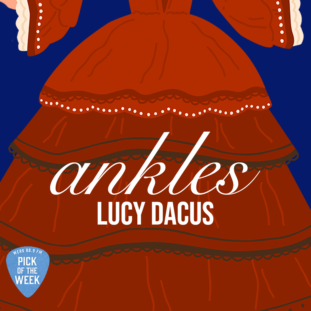 In front of a dark blue background, a red, embroidered dress has white text on it reading "Ankles" and "Lucy Dacus."