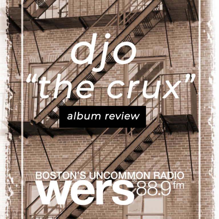 A monotone fire escape is behind white text reading "djo," "album review," and "the crux"