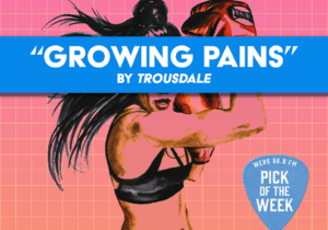 In front of a gridded pink and orange background, a woman boxer swings towards the words "Growing Pains" and "by Trousdale"
